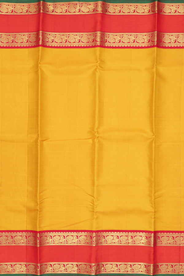Kanchipuram Silk Saree In Plain Yellow With Peacock Border
