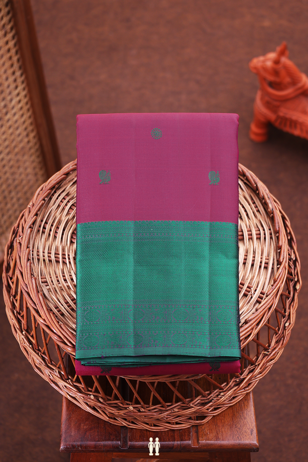 Kanchipuram Silk Saree In Plum Red With Peacock Buttas