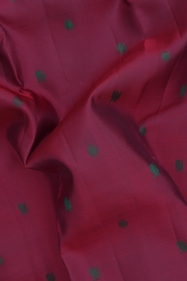 Kanchipuram Silk Saree In Plum Red With Peacock Buttas