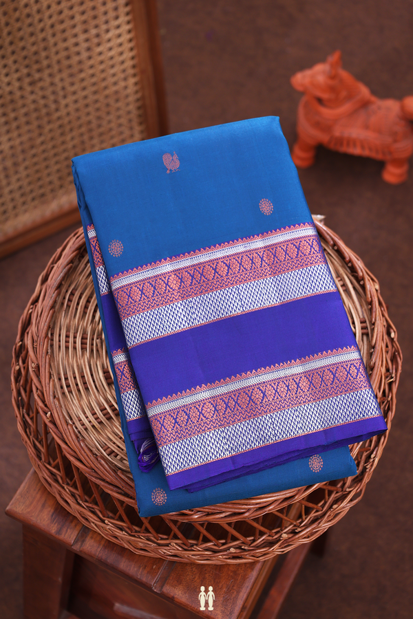 Kanchipuram Silk Saree In Prussian Blue With Peacock Buttas