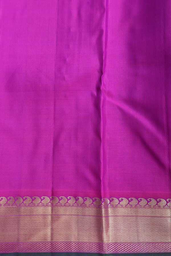 Kanchipuram Silk Saree In Purple With Floral Buttis