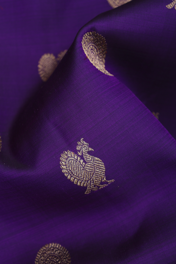 Kanchipuram Silk Saree In Regal Purple With Peacock Buttas