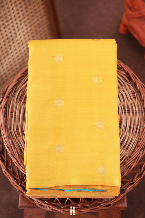 Kanchipuram Silk Saree In Saffron Yellow With Floral Buttas