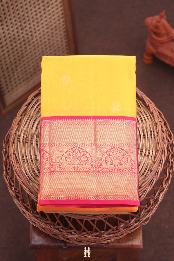 Kanchipuram Silk Saree In Saffron Yellow With Floral Buttas