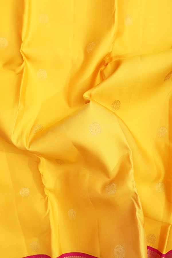 Kanchipuram Silk Saree In Saffron Yellow With Floral Buttas