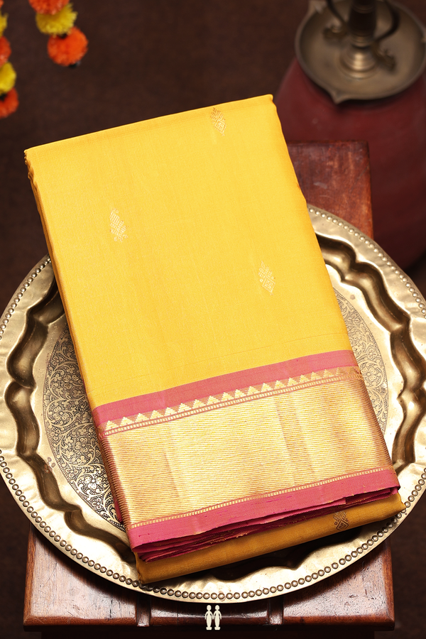 Kanchipuram Silk Saree In Saffron Yellow With Paisley Buttas