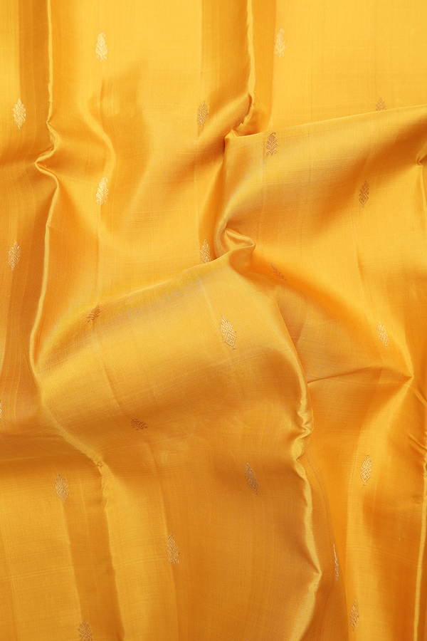 Kanchipuram Silk Saree In Saffron Yellow With Paisley Buttas
