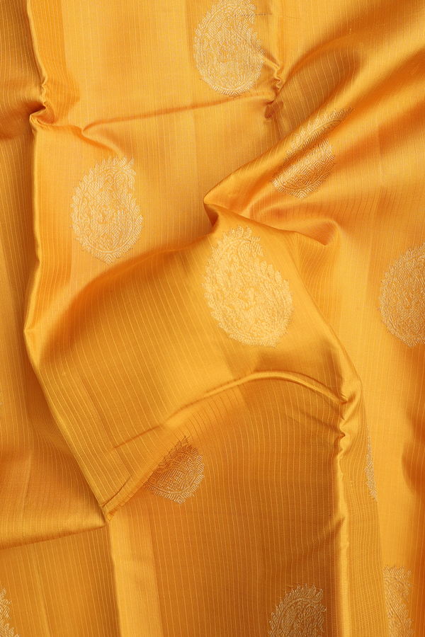 Kanchipuram Silk Saree In Saffron Yellow With Paisley Motifs