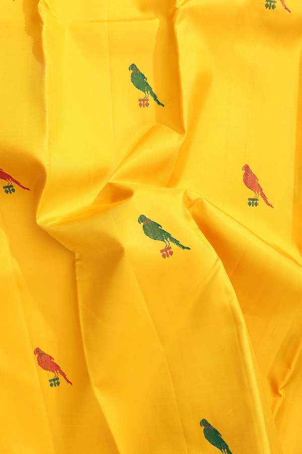 Kanchipuram Silk Saree In Saffron Yellow With Parrot Buttas