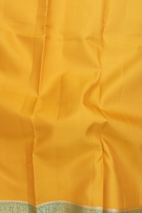 Kanchipuram Silk Saree In Saffron Yellow With Peacock Border