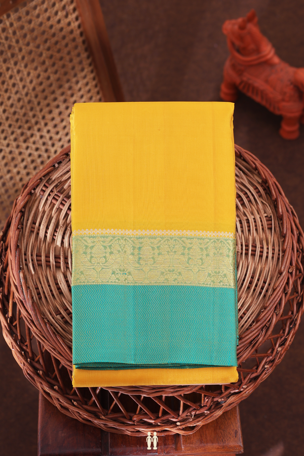 Kanchipuram Silk Saree In Saffron Yellow With Peacock Border