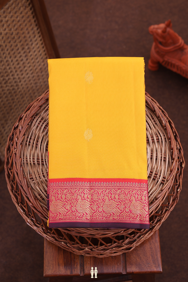 Kanchipuram Silk Saree In Saffron Yellow With Peacock Buttas
