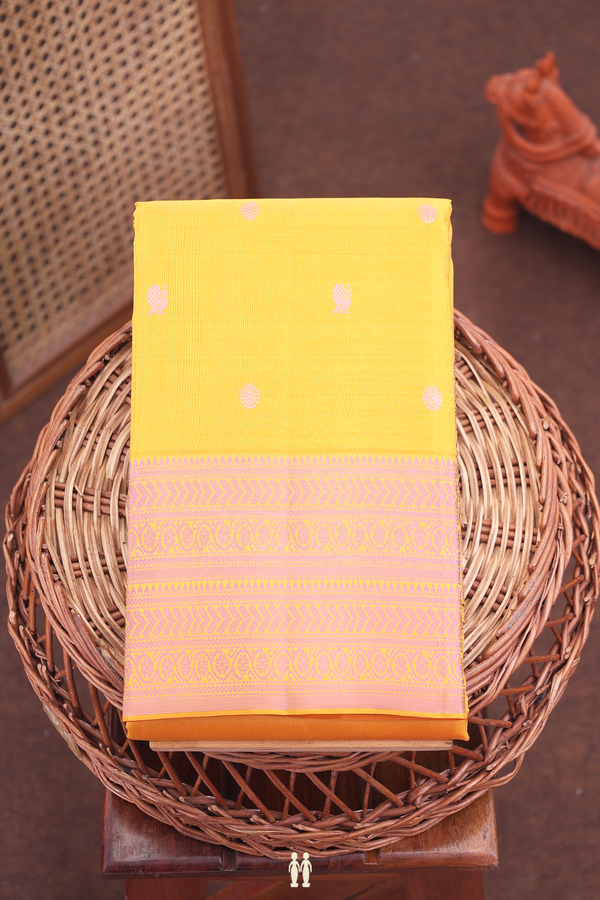 Kanchipuram Silk Saree In Saffron Yellow With Peacock Buttas