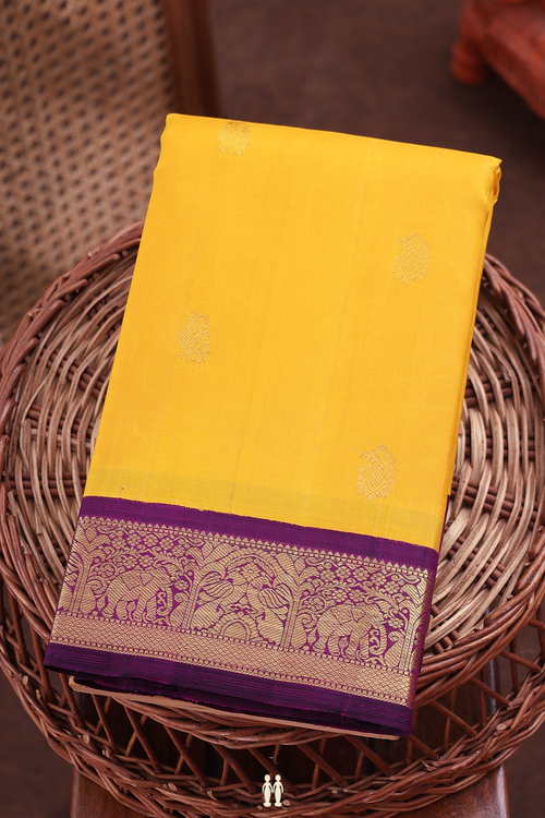 Kanchipuram Silk Saree In Saffron Yellow With Peacock Buttas
