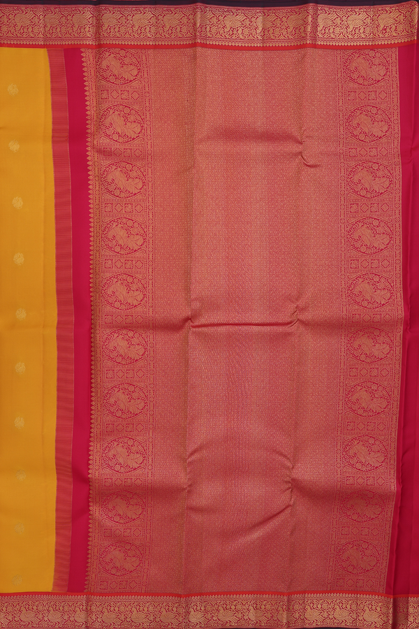 Kanchipuram Silk Saree In Saffron Yellow With Peacock Buttas