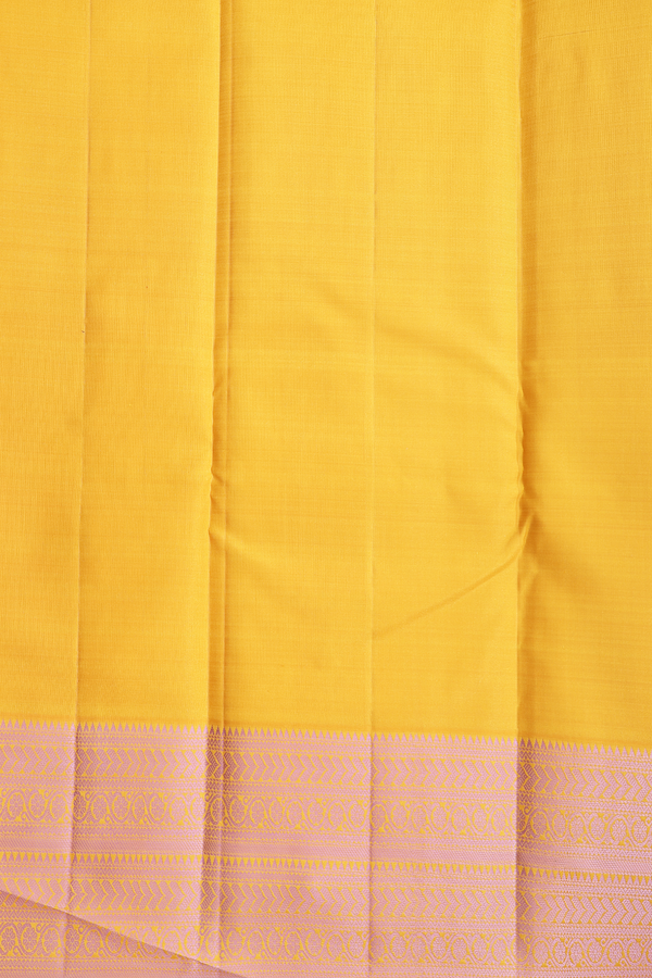 Kanchipuram Silk Saree In Saffron Yellow With Peacock Buttas