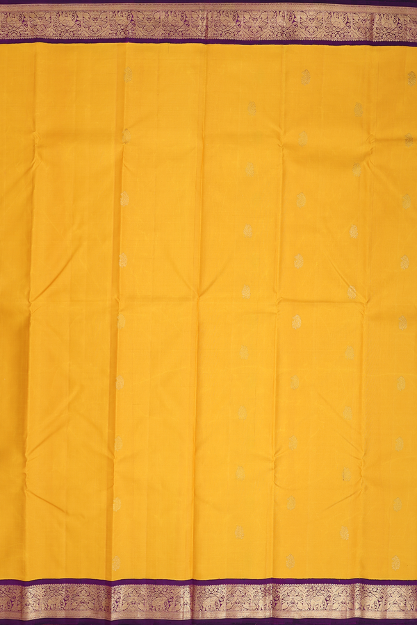 Kanchipuram Silk Saree In Saffron Yellow With Peacock Buttas