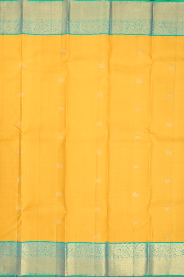 Kanchipuram Silk Saree In Saffron Yellow With Peacock Buttas