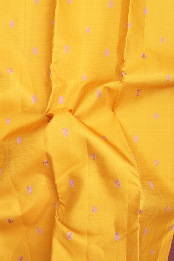 Kanchipuram Silk Saree In Saffron Yellow With Peacock Buttas