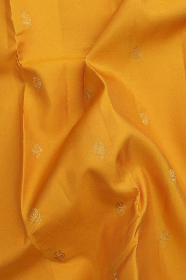 Kanchipuram Silk Saree In Saffron Yellow With Peacock Buttas