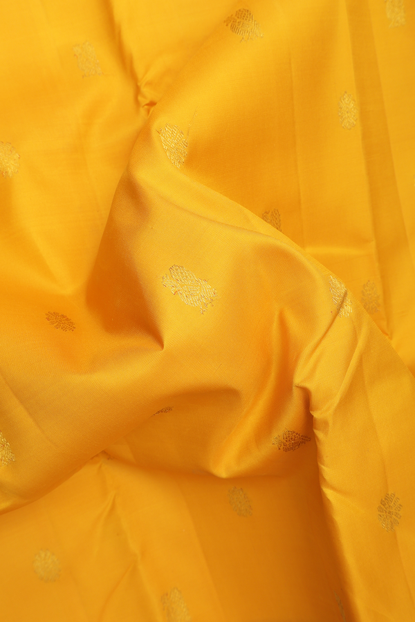 Kanchipuram Silk Saree In Saffron Yellow With Peacock Buttas