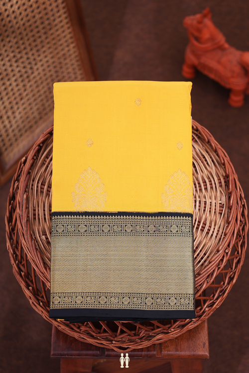 Kanchipuram Silk Saree In Saffron Yellow With Zari Buttas