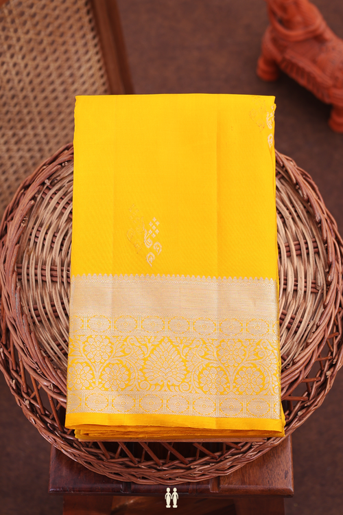 Kanchipuram Silk Saree In Saffron Yellow With Zari Buttas