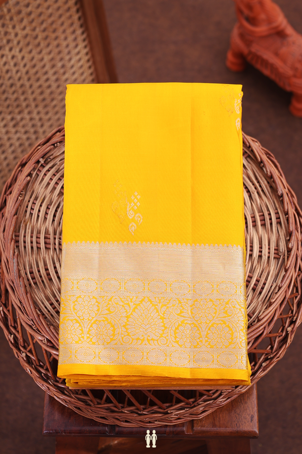 Kanchipuram Silk Saree In Saffron Yellow With Zari Buttas