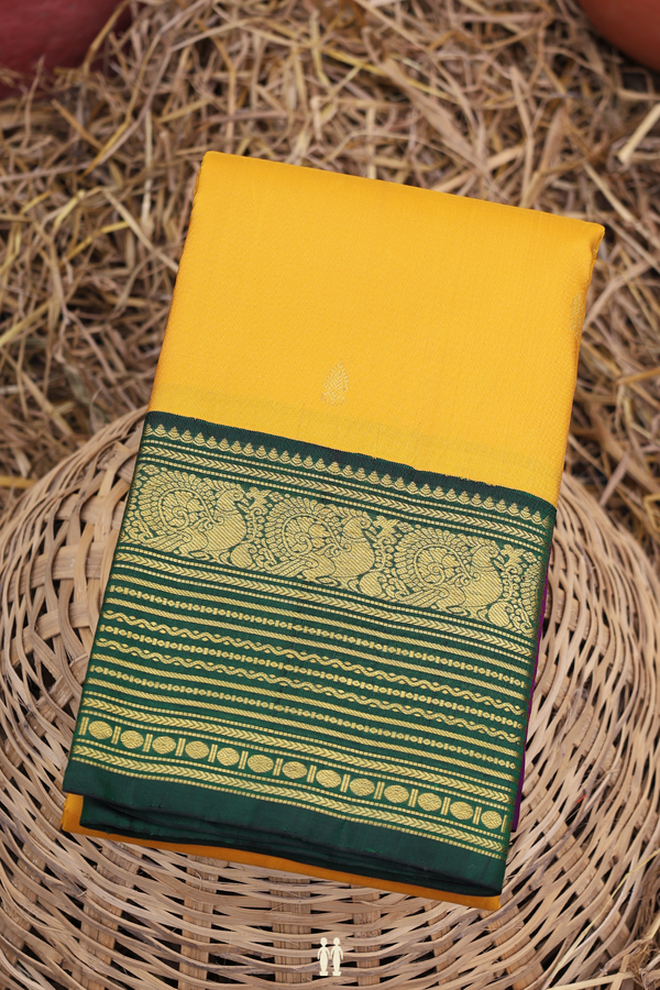 Kanchipuram Silk Saree In Saffron Yellow With Zari Buttas