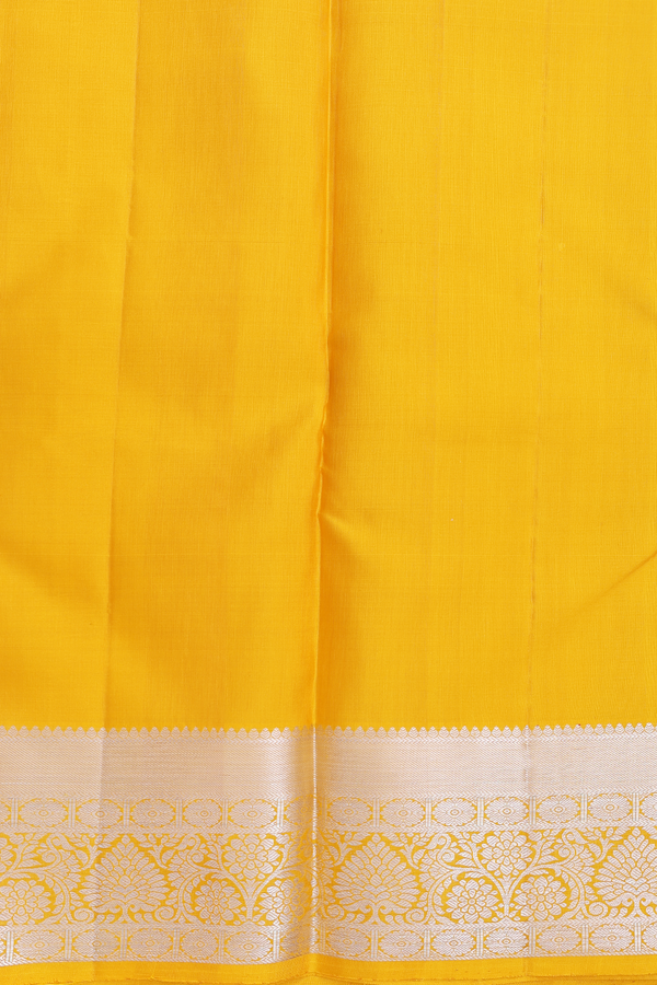 Kanchipuram Silk Saree In Saffron Yellow With Zari Buttas