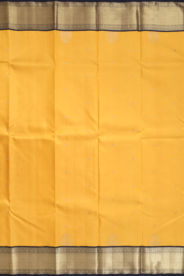Kanchipuram Silk Saree In Saffron Yellow With Zari Buttas