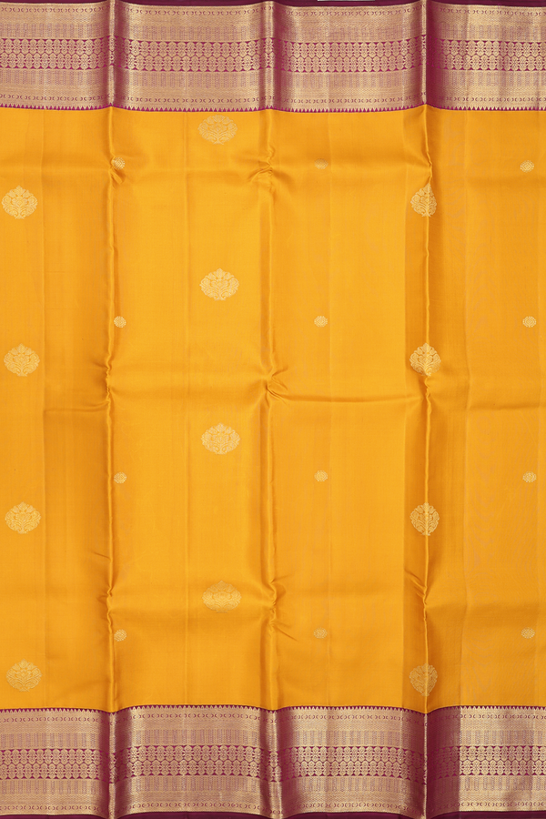 Kanchipuram Silk Saree In Saffron Yellow With Zari Buttas