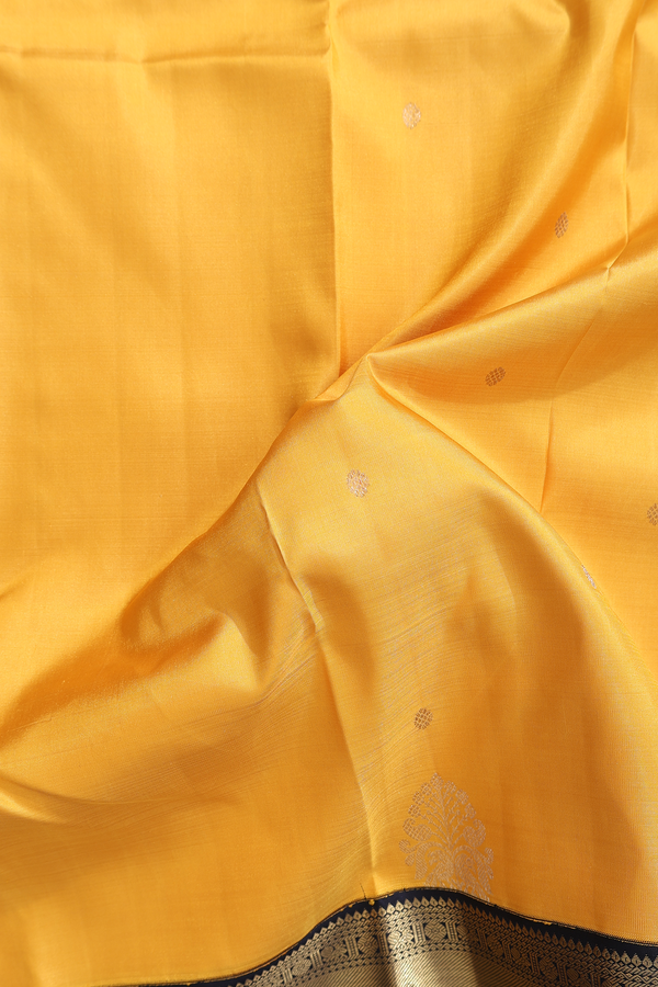 Kanchipuram Silk Saree In Saffron Yellow With Zari Buttas