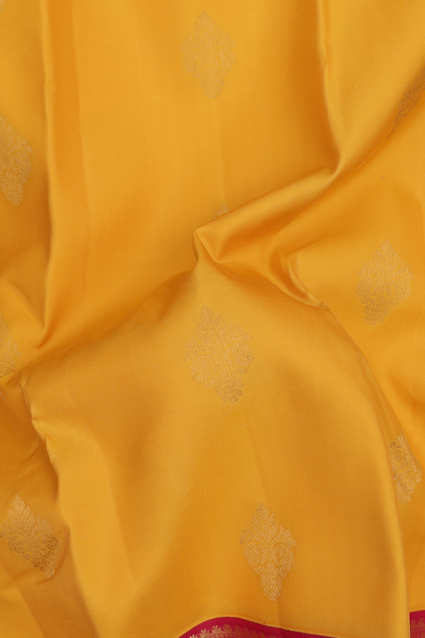 Kanchipuram Silk Saree In Saffron Yellow With Zari Buttas