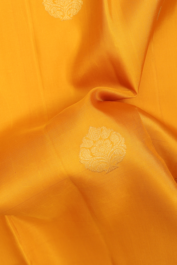Kanchipuram Silk Saree In Saffron Yellow With Zari Buttas