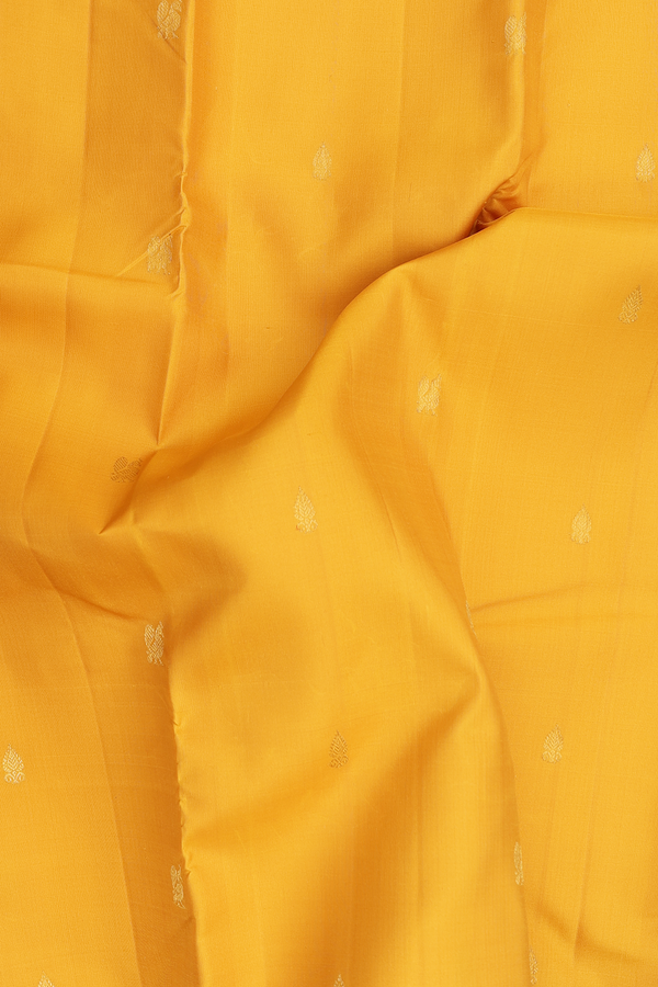 Kanchipuram Silk Saree In Saffron Yellow With Zari Buttas