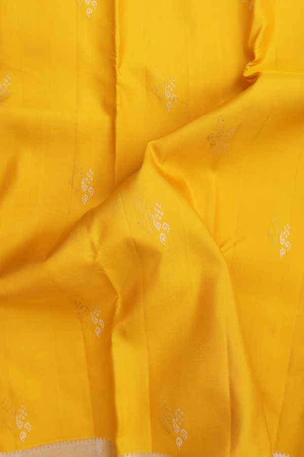 Kanchipuram Silk Saree In Saffron Yellow With Zari Buttas