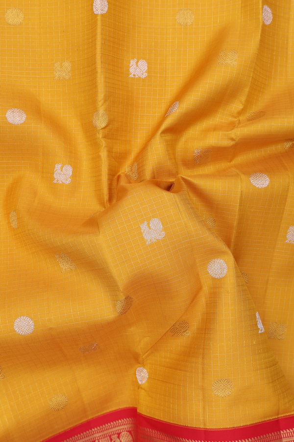 Kanchipuram Silk Saree In Yellow Along Checks With Buttas