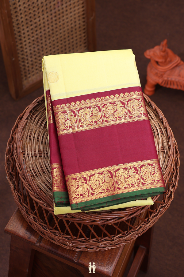 Kanchipuram Silk Saree In Yellow With Iruthalai Pakshi Buttas