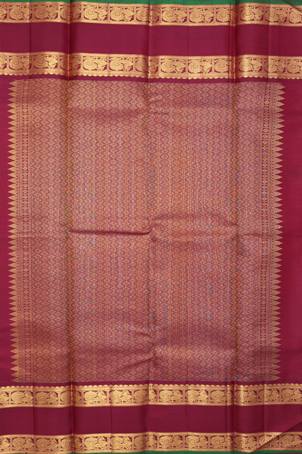 Terracotta red annam chakram with checked kanchipuram silk saree, zari border of gopuram, iruthalai pakshi, mayil kann, and yaali designs, and intricate pallu