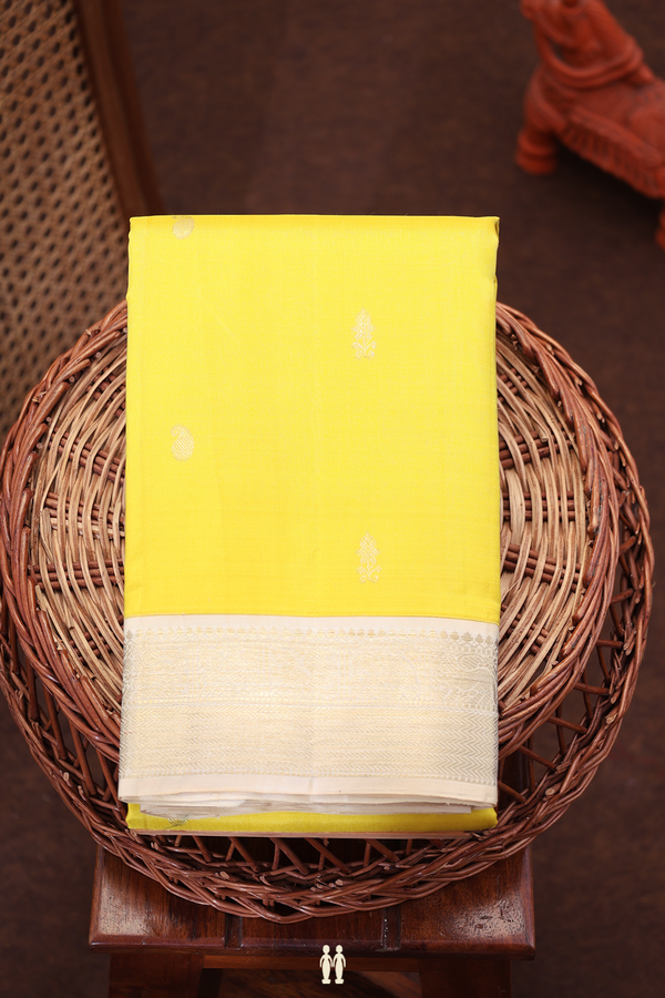 Kanchipuram Silk Saree In Yellow With Paisley Buttas