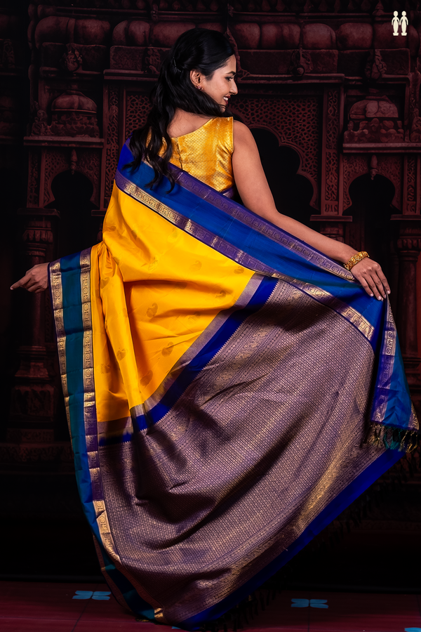 Kanchipuram Silk Saree In Yellow With Paisley Buttas