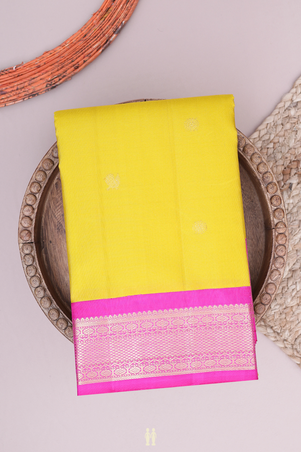 Kanchipuram Silk Saree In Yellow With Peacock Buttas