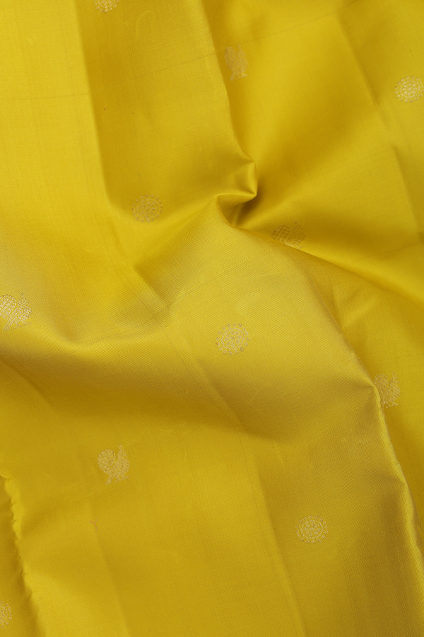 Kanchipuram Silk Saree In Yellow With Peacock Buttas