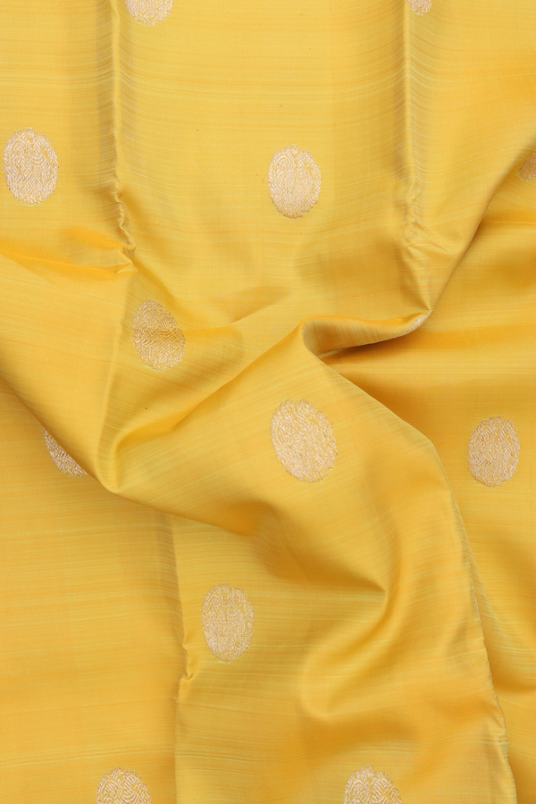 Kanchipuram Silk Saree In Yellow With Peacock Buttas