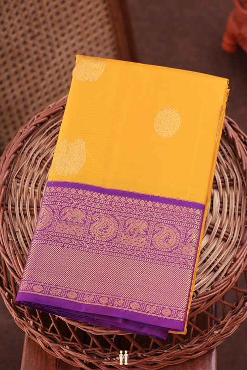 Kanchipuram Silk Saree In Yellow With Peacock Chakram Buttas