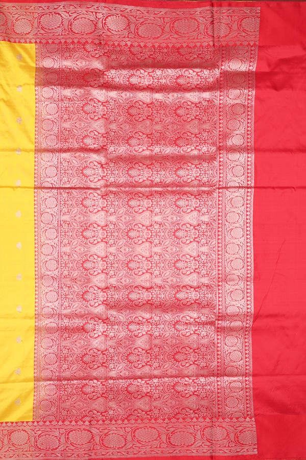 Banarasi Silk Saree In Saffron Yellow With Floral Buttas