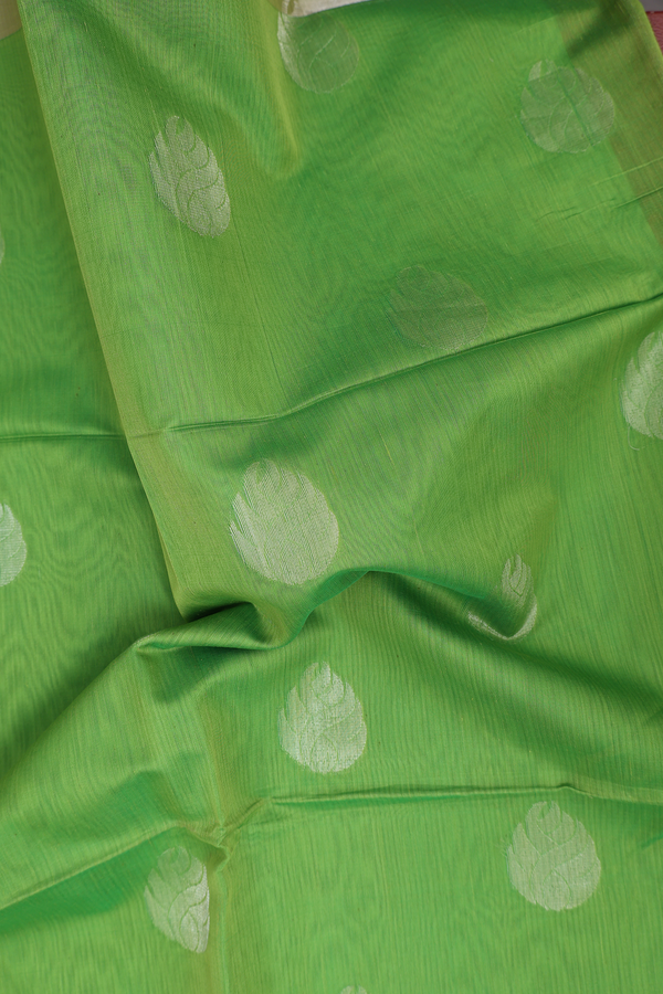 Kora Silk Cotton Saree In Parrot Green With Floral Buttas
