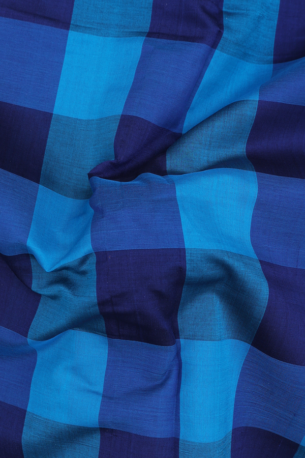 Semi Silk Cotton Saree In Shades Of Blue With Checks Design