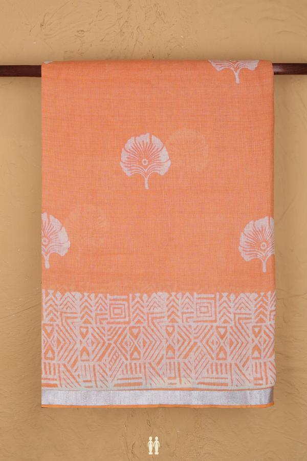 Linen Saree In Pastel Orange With Floral Buttas